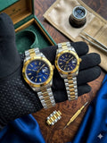 Dupe Rolex two-tone gold and silver couples watch set with blue dials, displayed with box and accessories