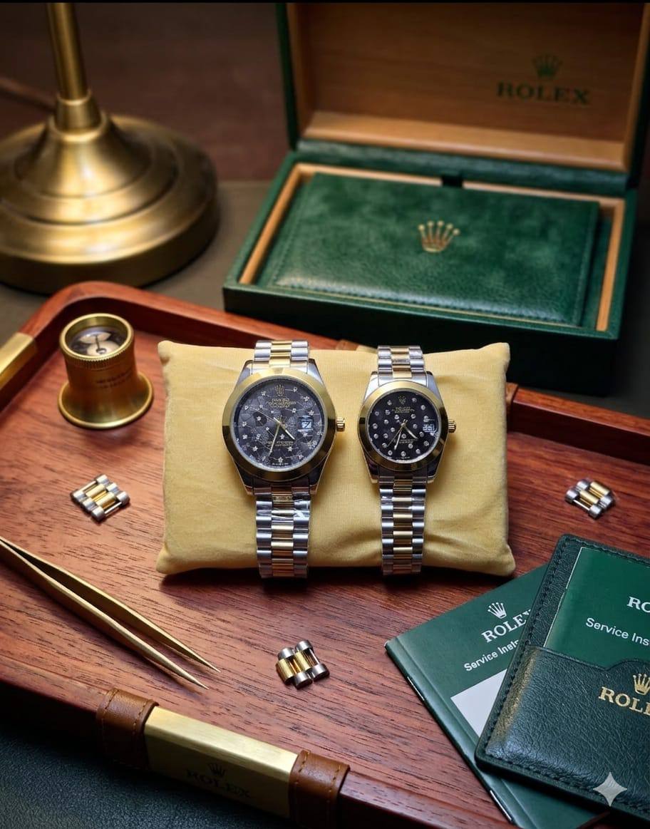 Rolex dupe couples watch set with two-tone stainless steel bands, black dials, and branded green box
